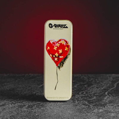 GROLLZ 4-times World кутия с Banksy graffiti дизайн и мотив сърце в продуктов кадър.