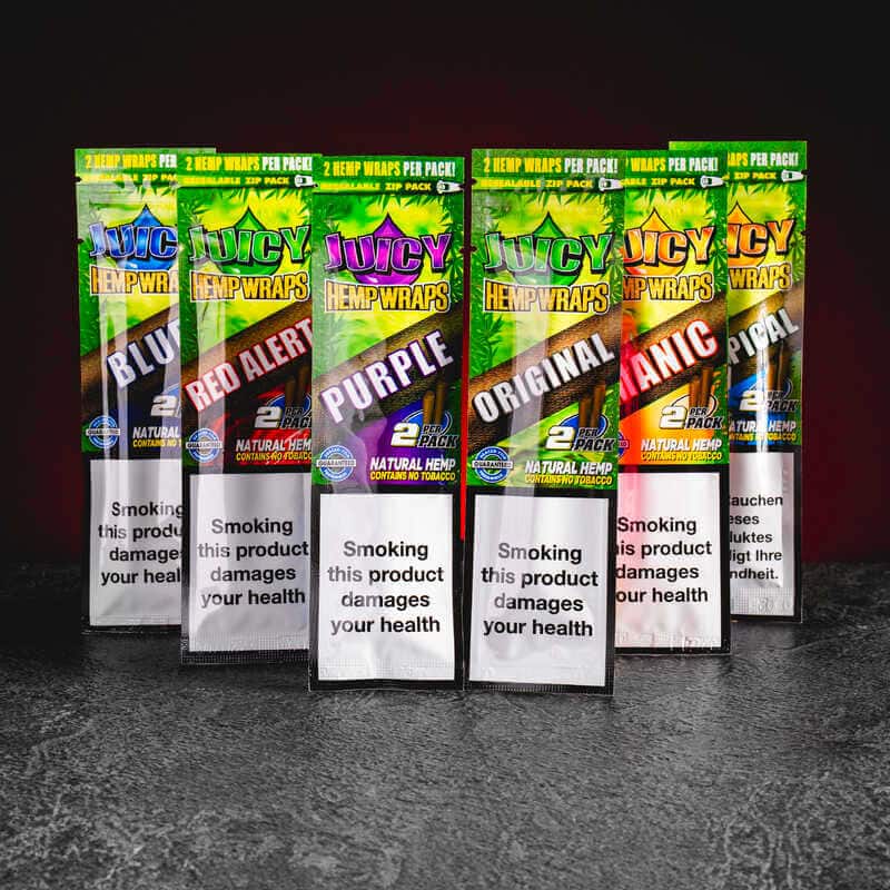 Juicy hemp wraps, представени в продуктов кадър като конопени аксесоари за CBD, HHC и билкови продукти.