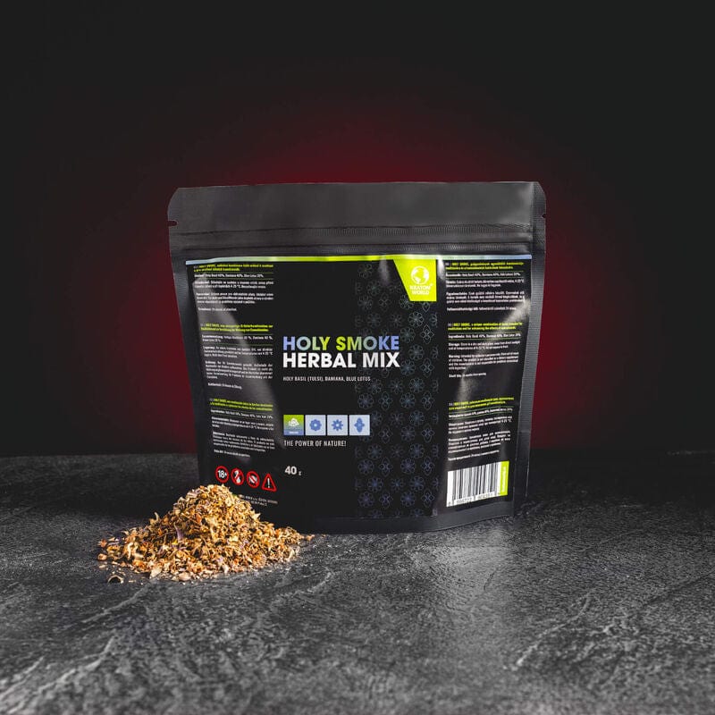 Holy Smoke Herbal Mix Kratom World, представен в продуктов кадър като билков smoke blend с damiana и lotus профил.