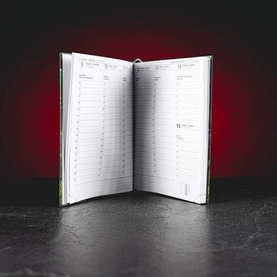 Записник Kratom World Karlos Vémola, показан отвътре в продуктов кадър като бележник за записки.