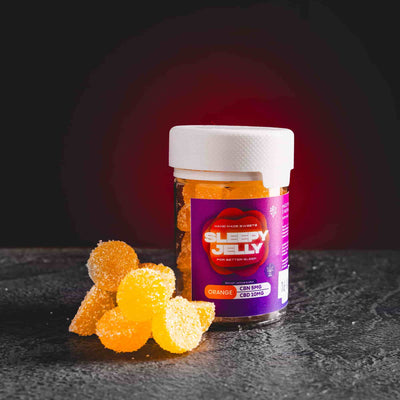 Sleep Jelly Orange Kratom World, представени в продуктов кадър като CBD jelly бонбони с портокалов профил за сън и релаксация.
