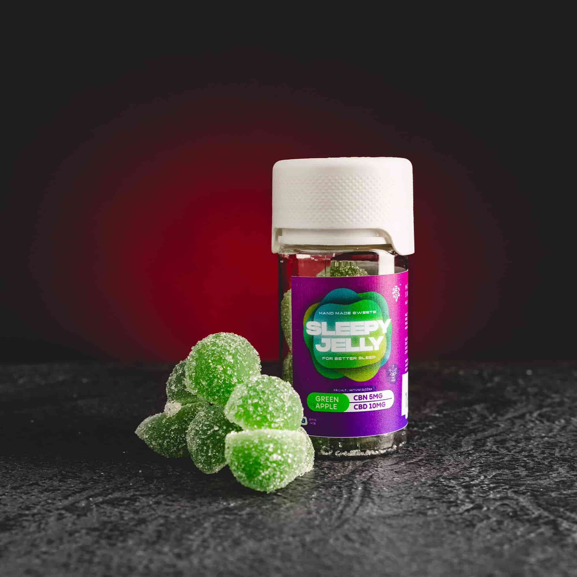 Sleepy Jelly Green Apple Kratom World, представени в продуктов кадър като CBD jelly бонбони със зелен ябълков профил за сън и релаксация.